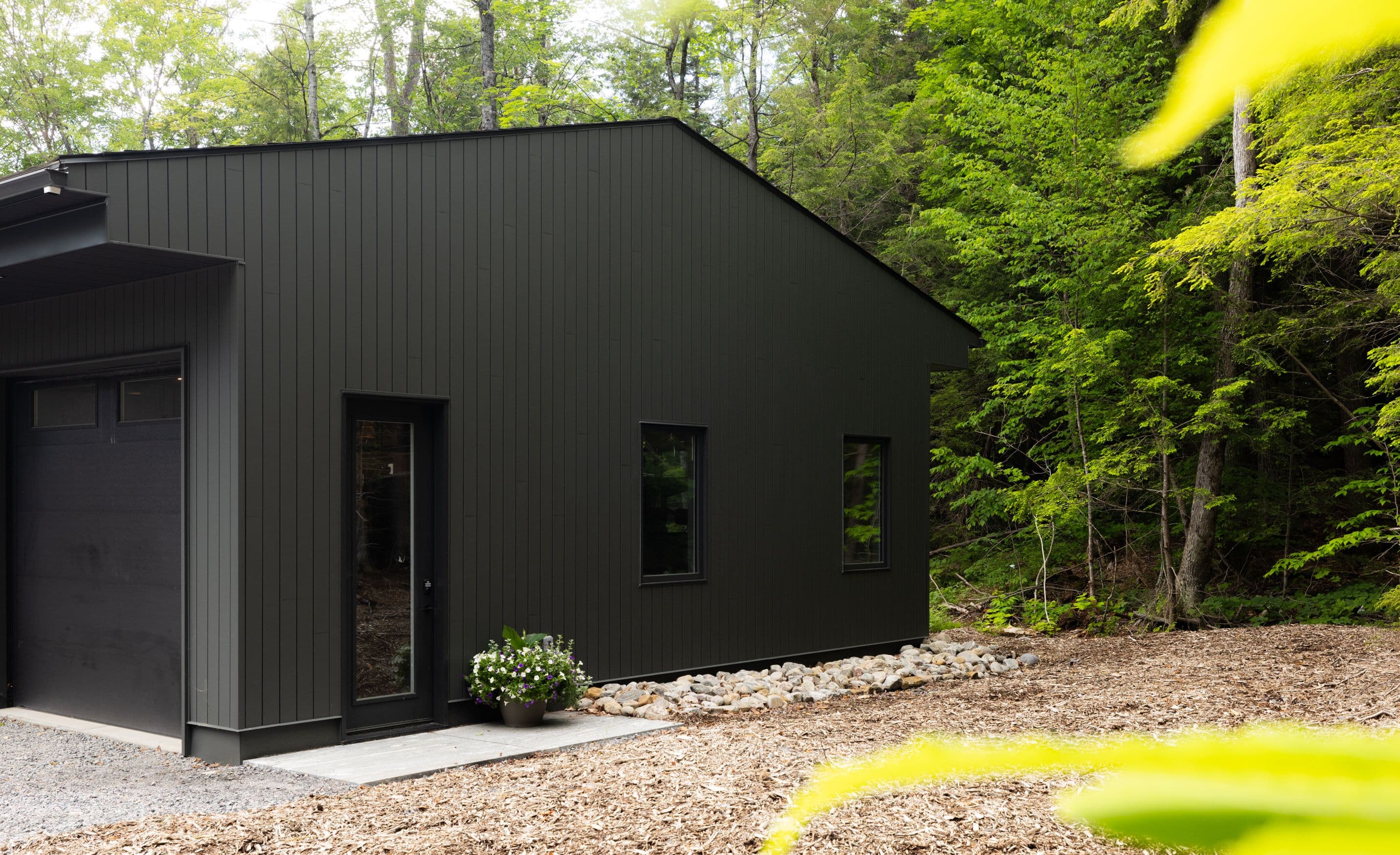 Custom-built bungalow at 15 Beechwood Drive surrounded by forest on 6+ acres, with Clear Lake access between Muskoka and Parry Sound